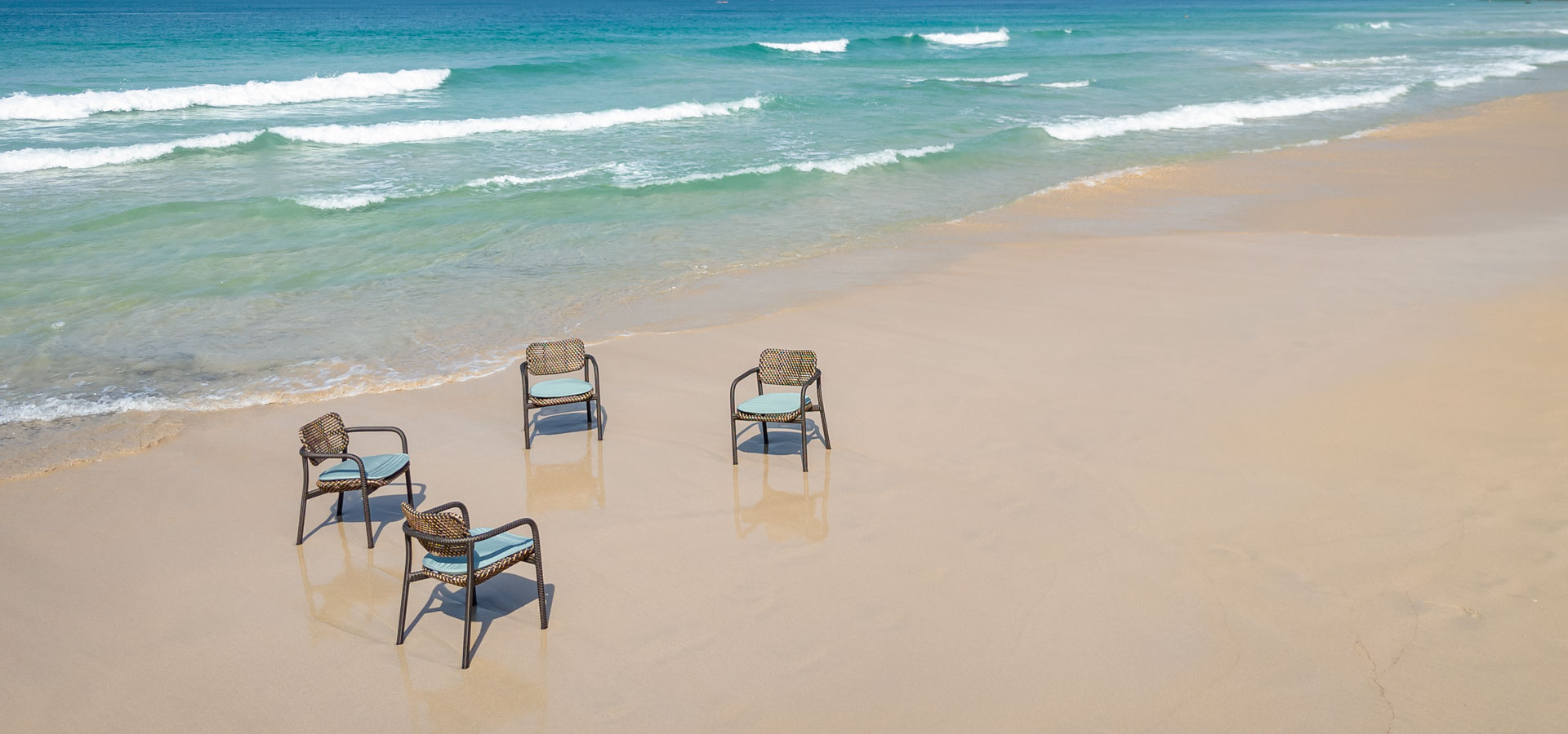 OHMM Kara Collection Outdoor Arm Chairs On The Beach